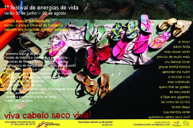 O novo outdoor anuncia o Festival de Energias de Vida, na parede da 'Galeria do Povo' em Cabelo Seco.